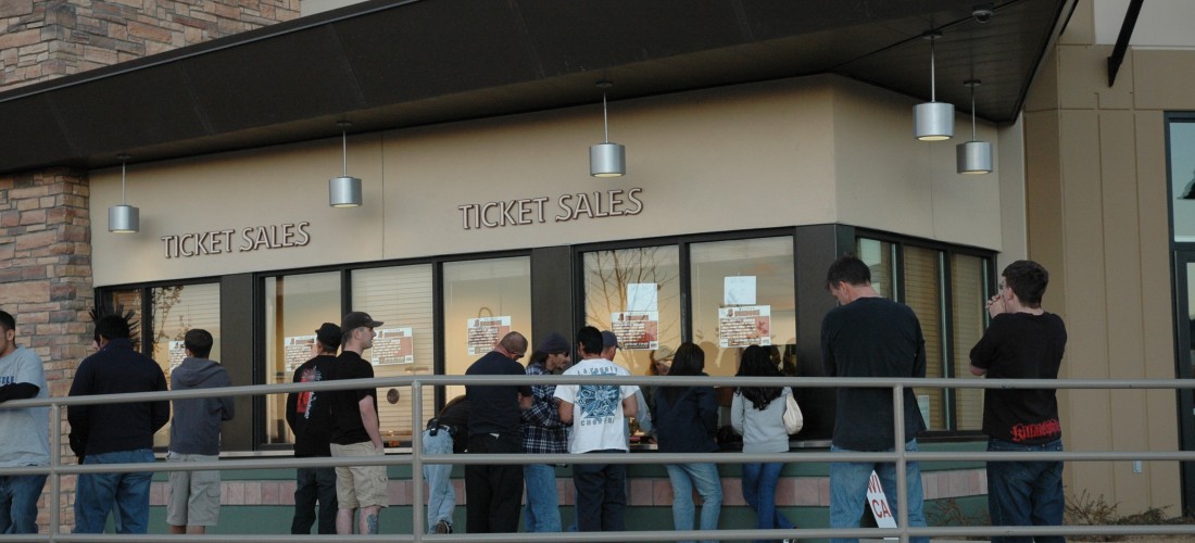 Patrons purchasing tickets at the arena box office.